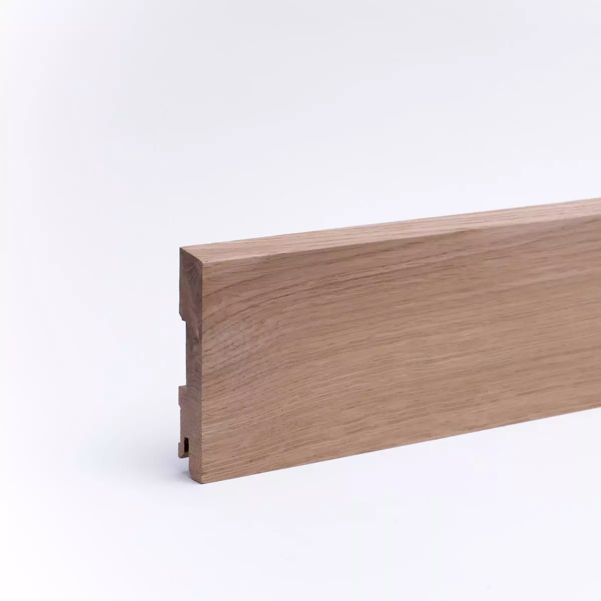 Solid wood skirting 100mm with chamfered front edge varnished oak